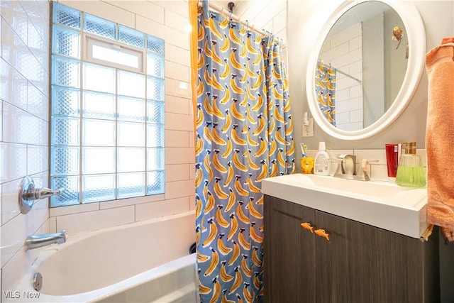 bathroom with shower / tub combo and vanity