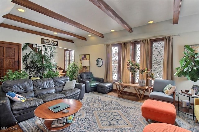 living room featuring beam ceiling and wood-type flooring