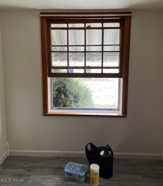 empty room with dark hardwood / wood-style floors