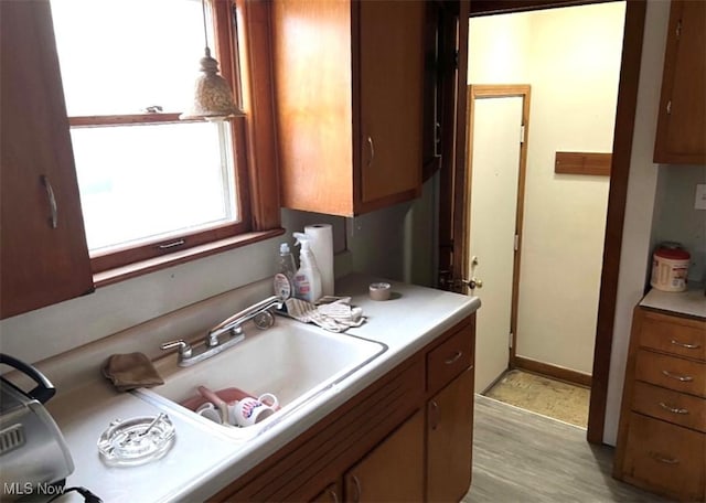 kitchen featuring sink and light wood-type flooring