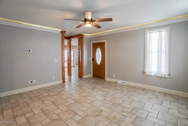 entrance foyer featuring ceiling fan and ornamental molding