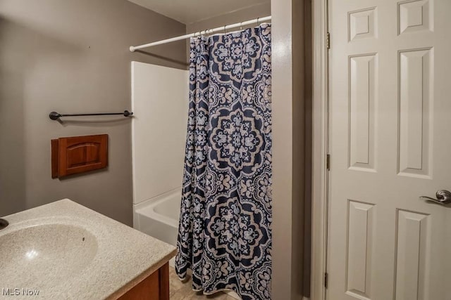 bathroom featuring shower / bathtub combination with curtain and vanity