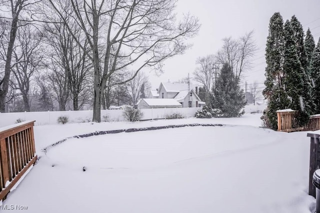 view of yard layered in snow