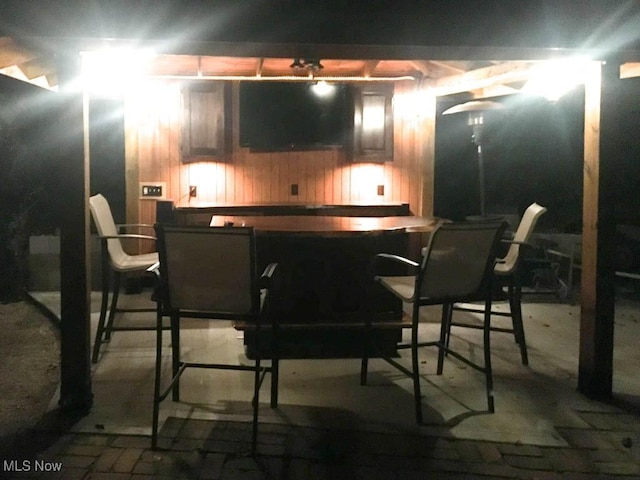 bar featuring wood walls