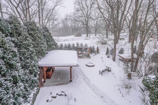 view of yard layered in snow