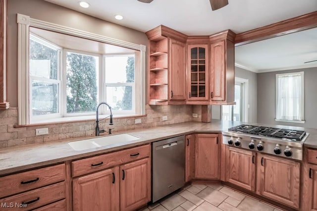 kitchen featuring appliances with stainless steel finishes, light tile patterned floors, ceiling fan, sink, and tasteful backsplash