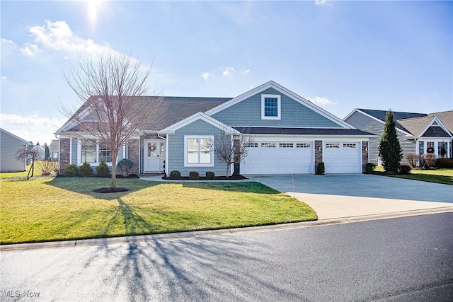 view of front of property featuring a garage and a front lawn