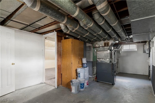 basement featuring heating unit