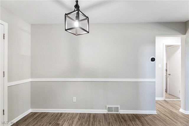 unfurnished dining area with hardwood / wood-style floors