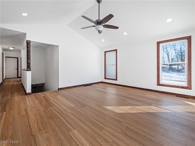 unfurnished living room featuring lofted ceiling, ceiling fan, and light hardwood / wood-style floors