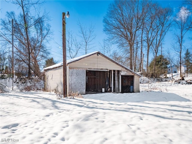 view of snow covered garage