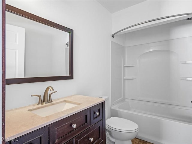 full bathroom featuring washtub / shower combination, vanity, and toilet