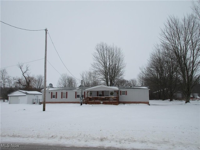 view of front facade with a garage and an outdoor structure