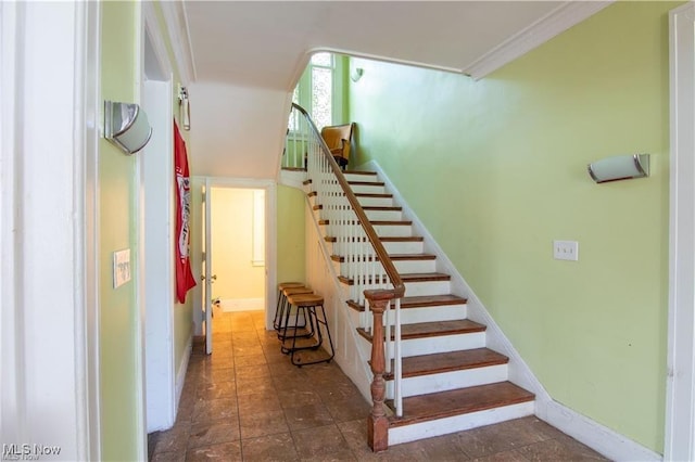 stairs featuring ornamental molding