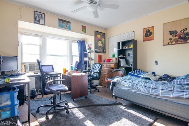 bedroom with ceiling fan, crown molding, and carpet flooring