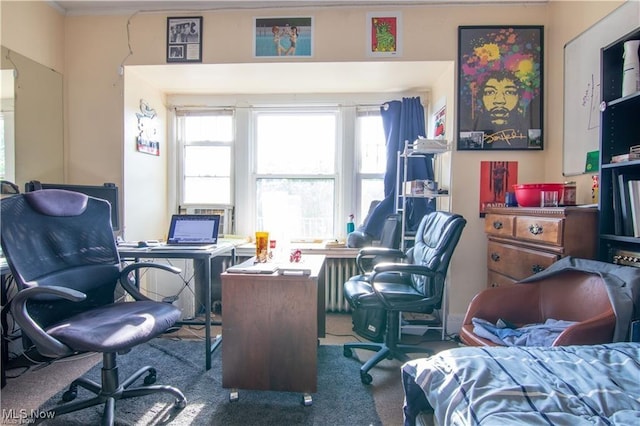 carpeted office featuring radiator heating unit