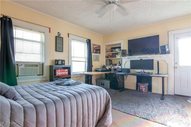 bedroom with a textured ceiling, ceiling fan, ornamental molding, and cooling unit