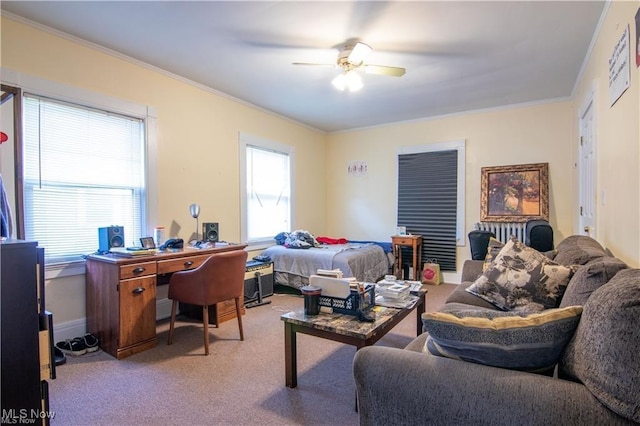 bedroom featuring ceiling fan, ornamental molding, and light colored carpet