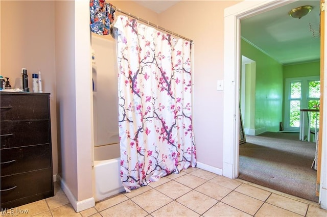 bathroom with shower / tub combo and tile patterned floors