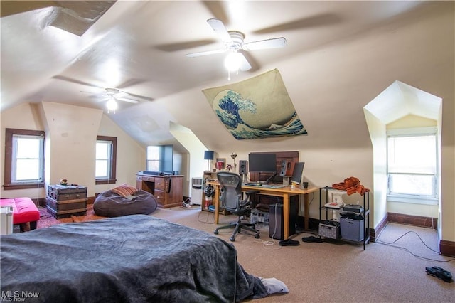 carpeted bedroom featuring lofted ceiling and ceiling fan