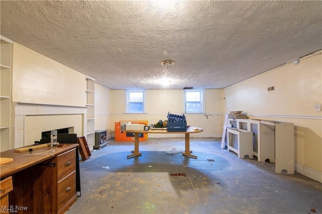 basement featuring a textured ceiling