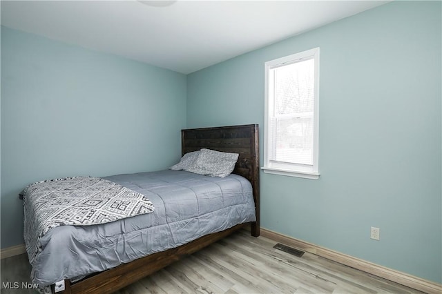 bedroom featuring light wood-type flooring