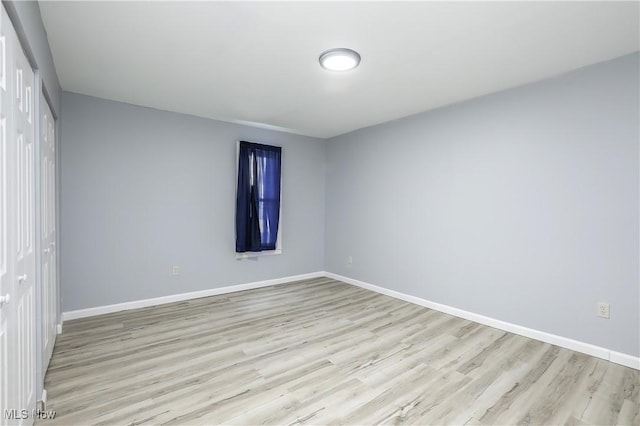 spare room featuring light wood-type flooring