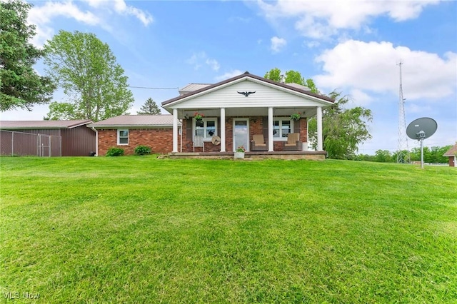 view of front of home featuring a front yard and a porch