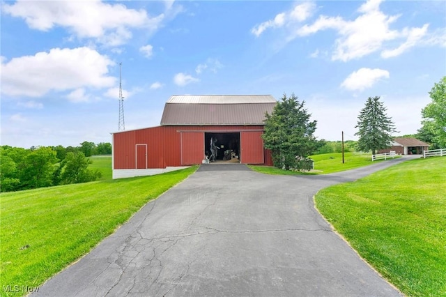 view of outdoor structure with a yard