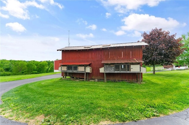 view of property exterior featuring a yard