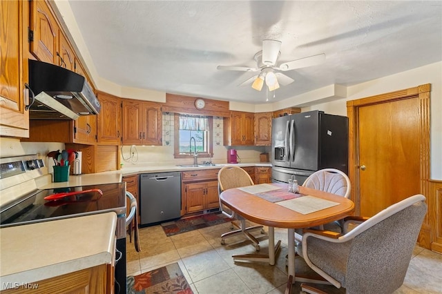 kitchen with stainless steel appliances, ceiling fan, light tile patterned floors, and sink