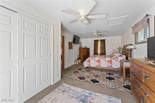 bedroom featuring a closet, ceiling fan, and carpet