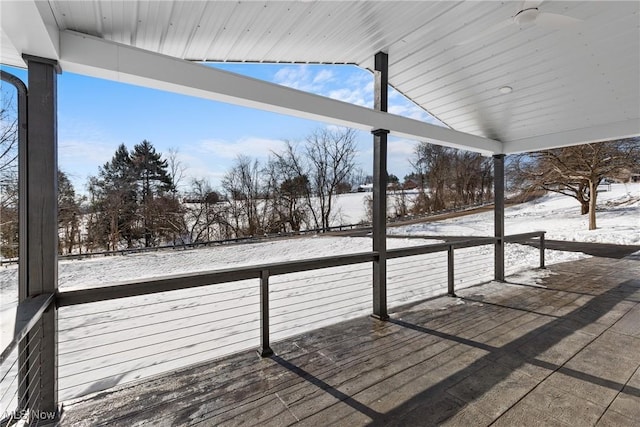 view of snow covered deck