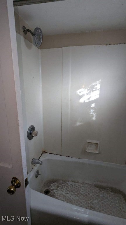 bathroom with shower / bath combination