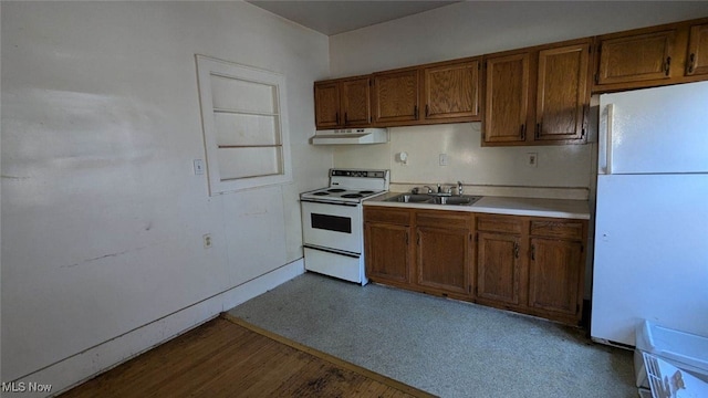 kitchen featuring white appliances and sink