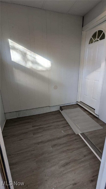 empty room with dark hardwood / wood-style floors