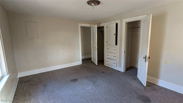 unfurnished bedroom with dark colored carpet