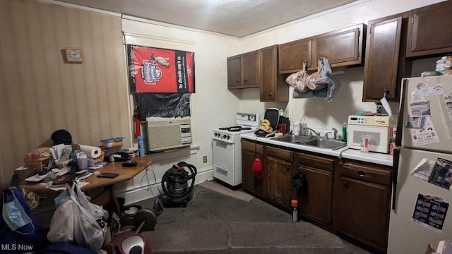 kitchen with white appliances, sink, and dark brown cabinetry