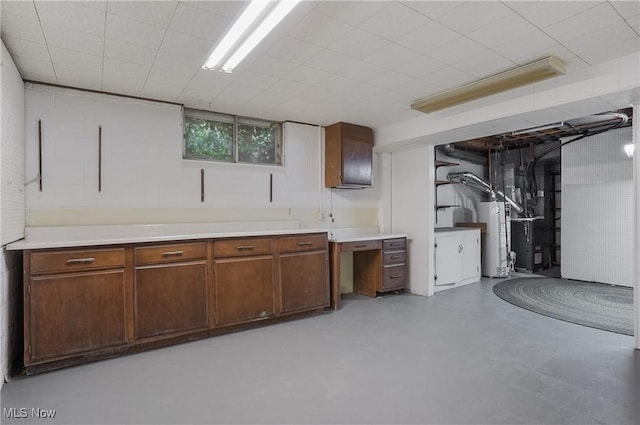 basement featuring heating unit and gas water heater