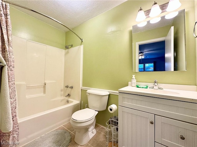 full bathroom featuring toilet, vanity, tile patterned flooring, shower / bathtub combination with curtain, and a textured ceiling