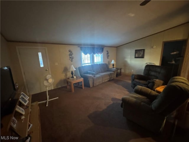 living room featuring ornamental molding and carpet