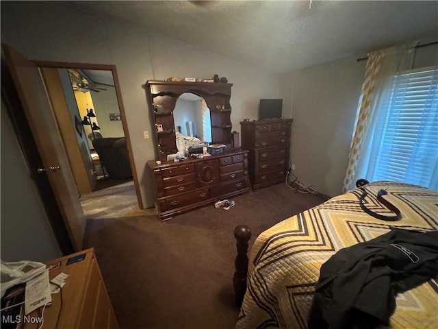 carpeted bedroom featuring vaulted ceiling