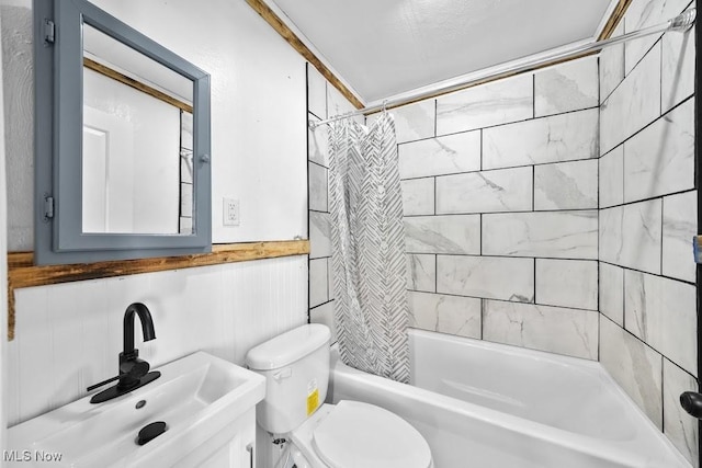 full bathroom with toilet, sink, and shower / bath combo with shower curtain