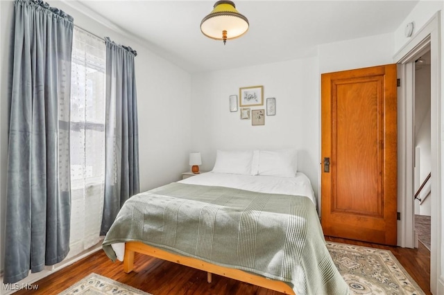 bedroom featuring wood-type flooring