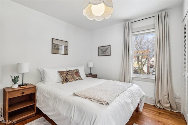 bedroom featuring a closet and hardwood / wood-style flooring