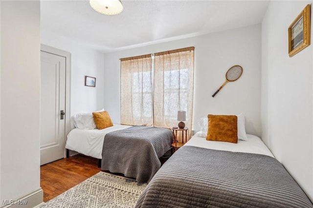 bedroom featuring wood-type flooring