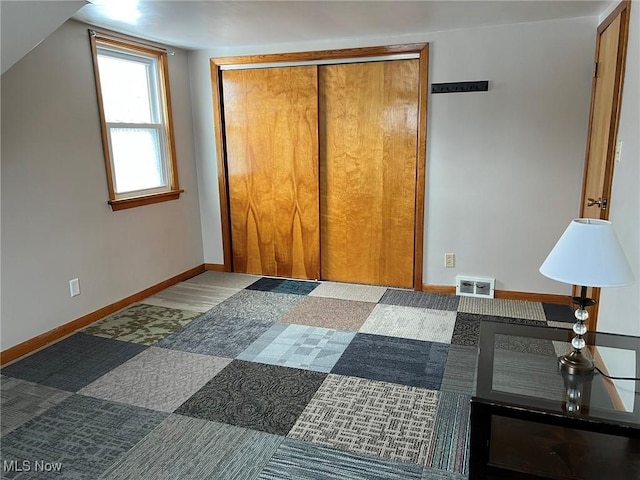 carpeted bedroom featuring a closet