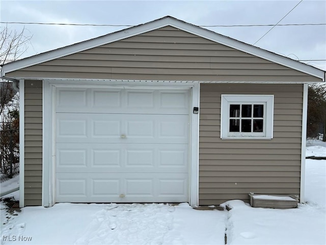 view of snow covered garage