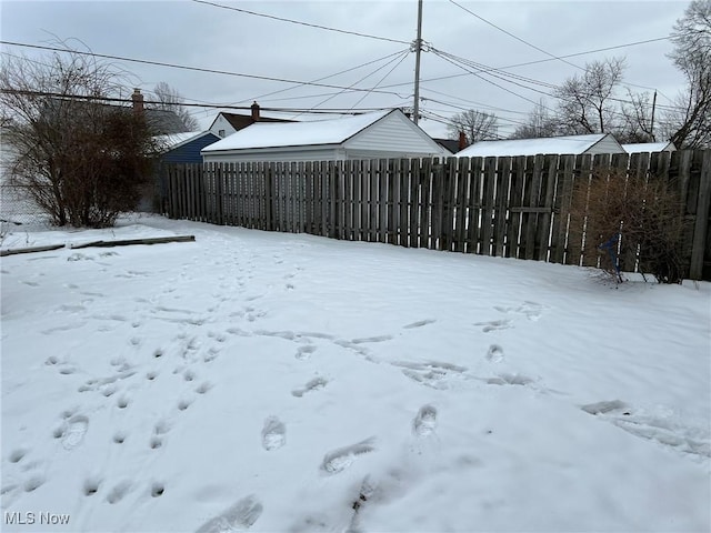 view of yard layered in snow