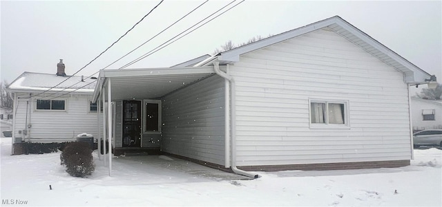 exterior space with a carport